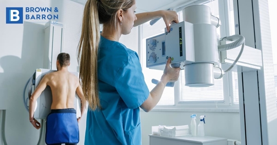 Radiologist performs a CT scan of a patient with COVID or Cancer